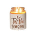 White Tis the Season sleeve used as a candle jar holder with lit jar inside