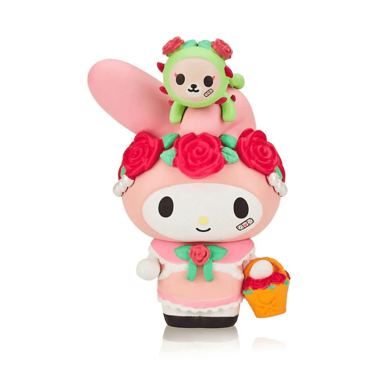 Tokidoki collectible My Melody & Rosie figure with red-rose garland and green cactus pup, carrying orange basket of blossoms.
