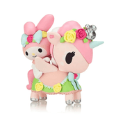 Tokidoki collectible My Melody & Petal riding pastel-pink Unicorno, skirted in green with yellow roses and silver hooves.
