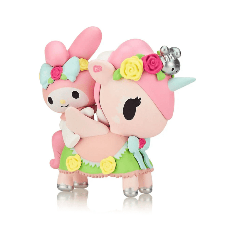Tokidoki collectible My Melody & Petal riding pastel-pink Unicorno, skirted in green with yellow roses and silver hooves.
