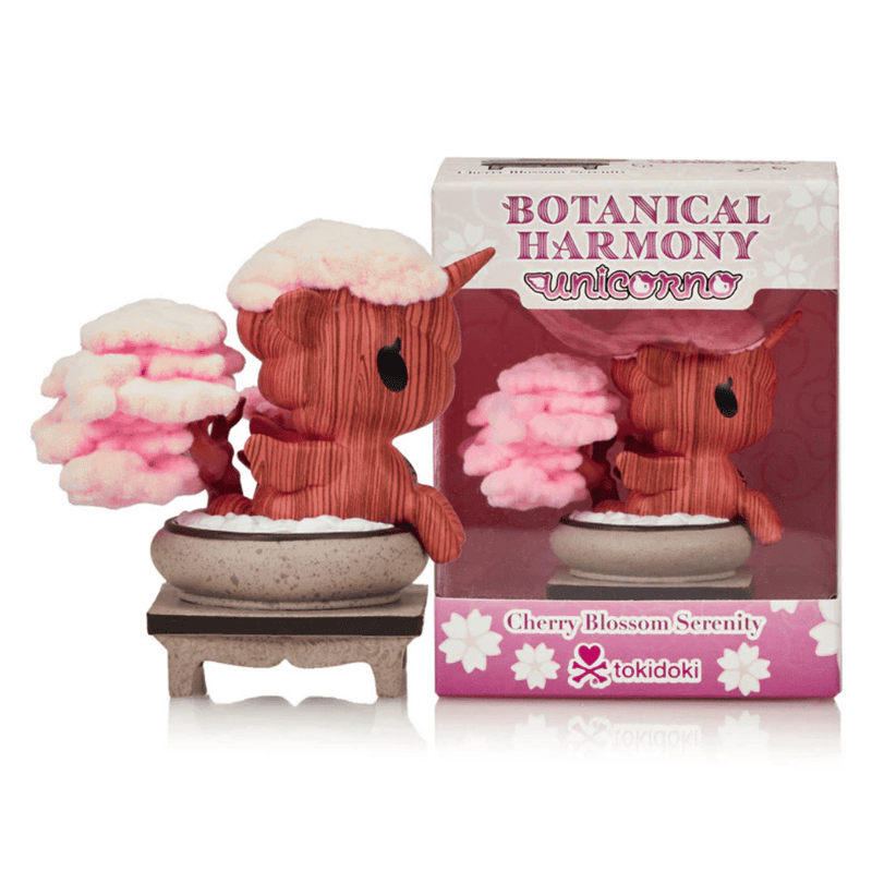Front view of Tokidoki Unicorno Cherry Blossom Serenity collectible figure in bonsai pot, displayed beside Botanical Harmony retail packaging.
