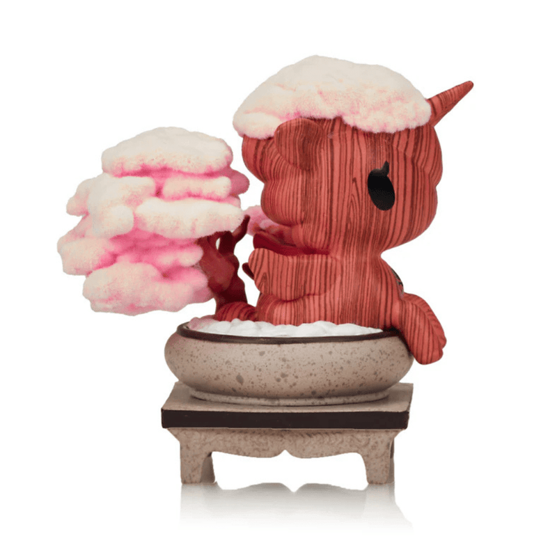Right profile of Tokidoki Cherry Blossom Serenity collectible figure, capturing sculpted bark pattern and soft pink sakura canopy in miniature planter.









