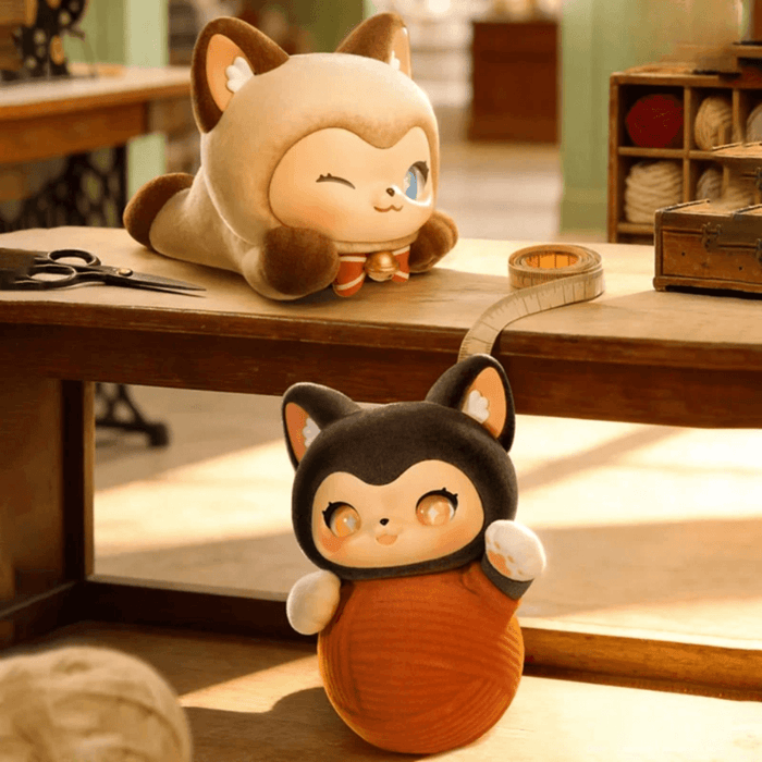 TOYZEROPLUS MOFFY’s Magic Furry Mewky Hide-and-Seek blind box figure wrapped in an orange ball of yarn