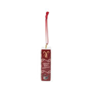 Red spine of the Twelve Days of Christmas ceramic book ornament with candy cane and swan illustrations