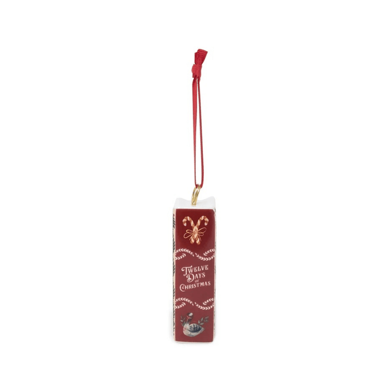 Red spine of the Twelve Days of Christmas ceramic book ornament with candy cane and swan illustrations