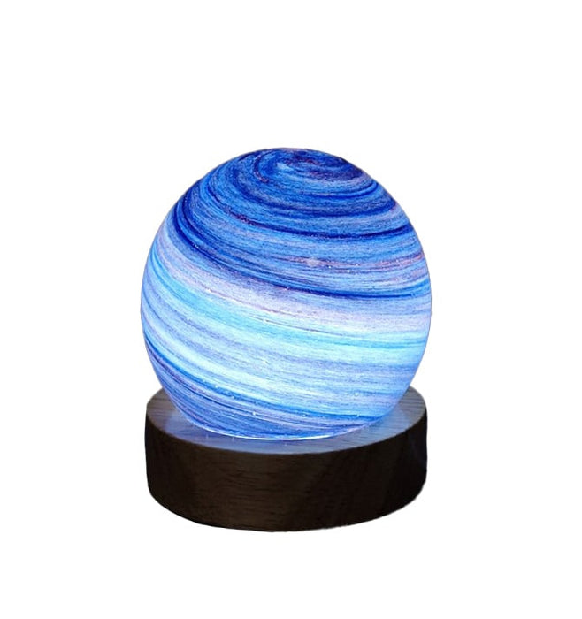 Twilight Glow blue planet USB night light, swirling indigo and sky-blue bands on wooden base, 8 cm lamp gift for children
