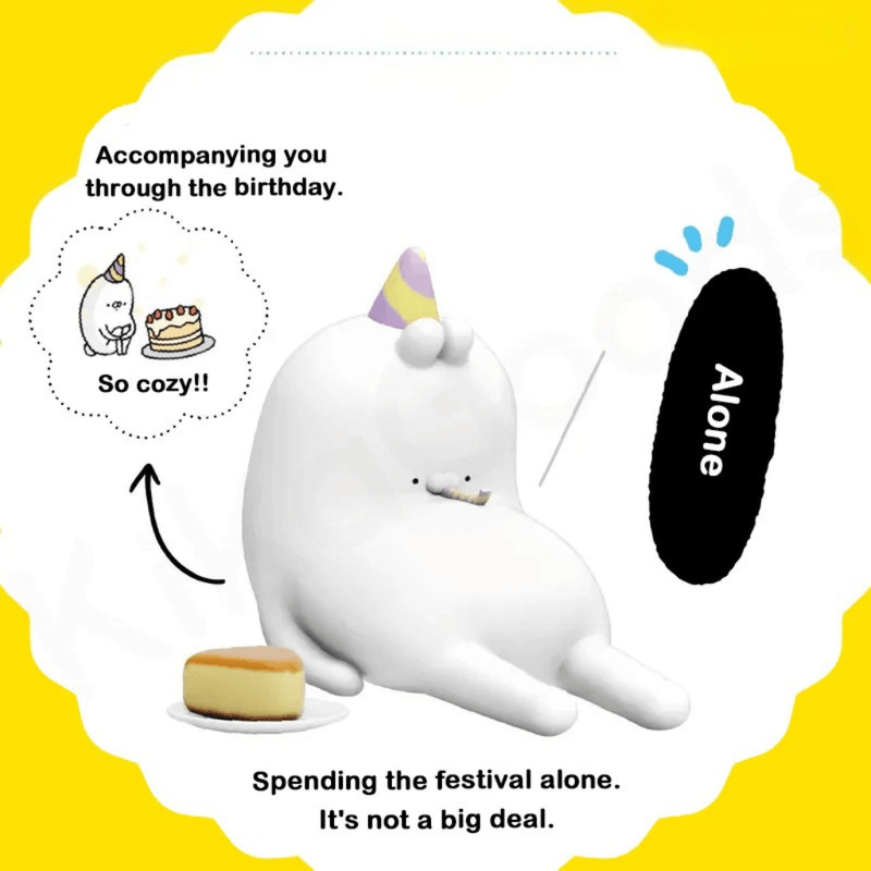 Ugly Rabbit’s Inner Drama Series blind box figure in Alone pose wearing a party hat beside a small cake