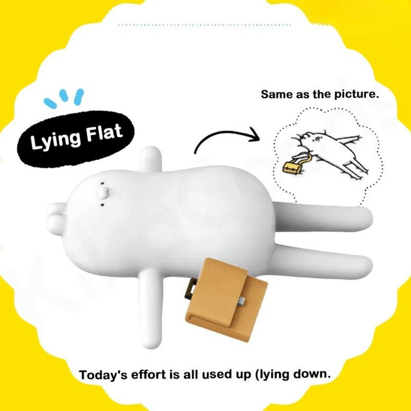 Ugly Rabbit’s Inner Drama Series blind box figure in Lying Flat pose stretched out with a small briefcase