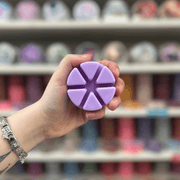Ultra Violet lilac segmented wax melt held in hand