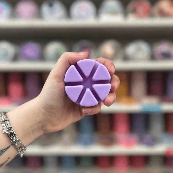 Ultra Violet lilac segmented wax melt held in hand