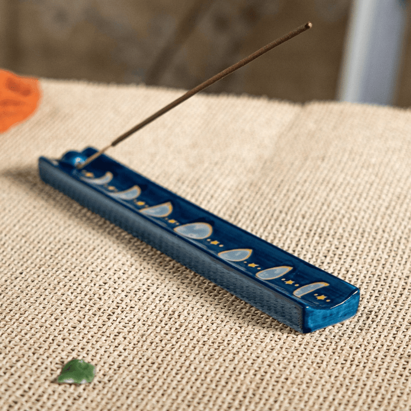 Urban Tokyo moon phase ceramic incense holder styled on woven surface