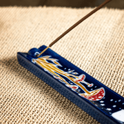 Toadstool incense holder with stick incense in lifestyle setting