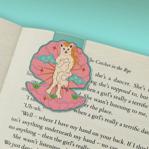 Venus Kitty magnetic bookmark marking a page in a book