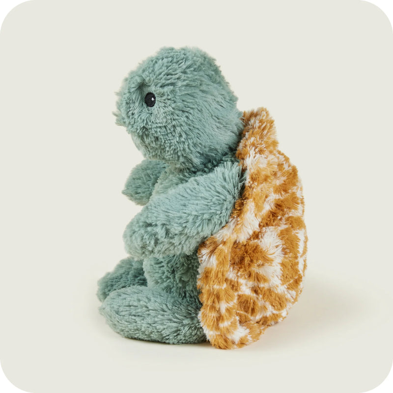 Left profile of plush baby turtle from Warmies

