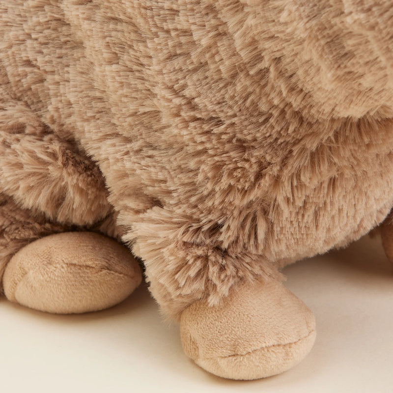 Close-up of the Warmies Heatable Capybara’s plush paws.