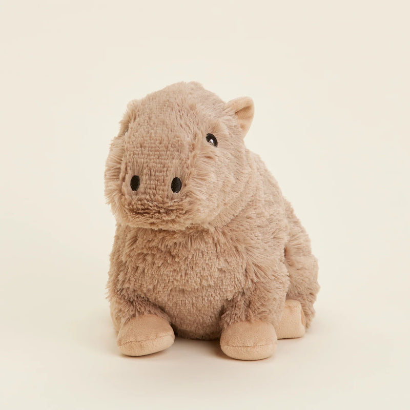 Tilted side view of the Warmies Heatable Capybara Plush Toy.