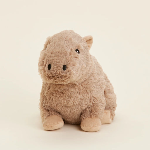 Tilted side view of the Warmies Heatable Capybara Plush Toy.