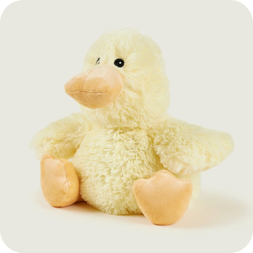 Angled view of Warmies chick with soft fluffy body

