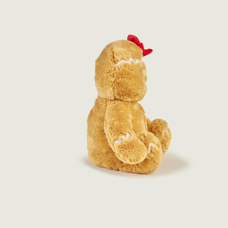 Side profile of Warmies Gingerbread Girl heatable plush with icing details.
