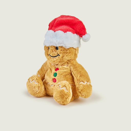 Three-quarter view of Warmies Gingerbread Man plush with Santa hat and icing details.
