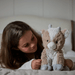 Warmies Goat plush toy in a bedroom lifestyle image