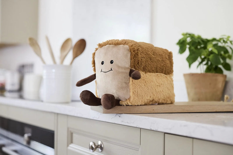 Warmies bread plush toy displayed on a kitchen worktop


