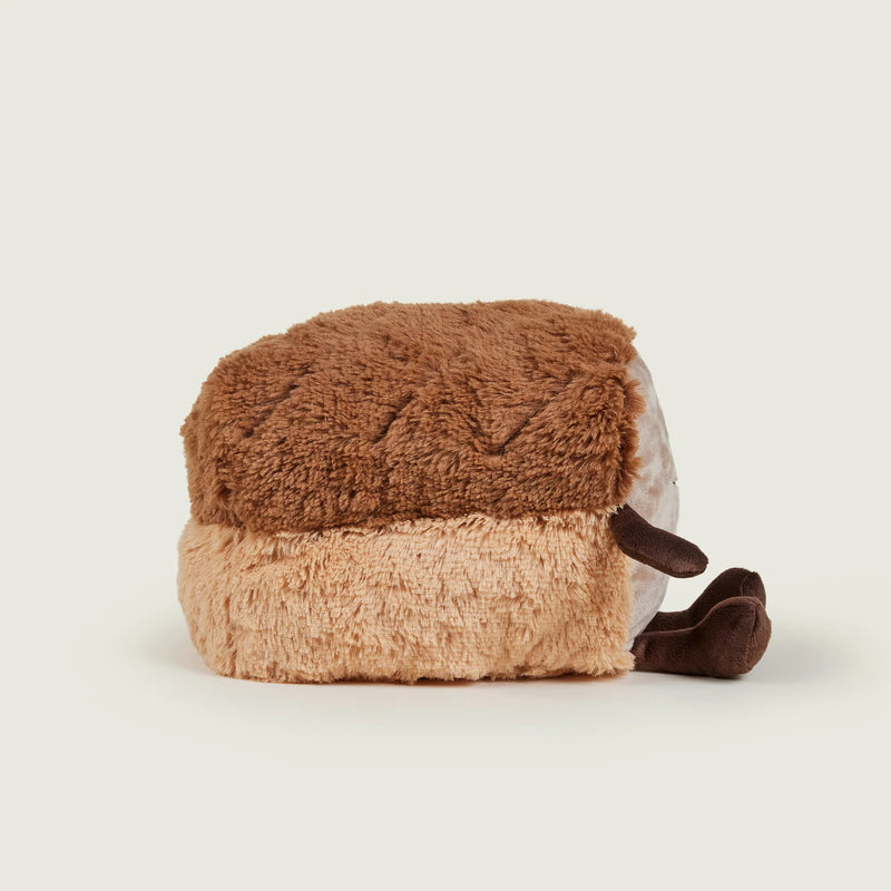 Side view of Warmies plush toy showing both crust and face

