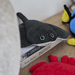 Warmies Manta Ray plush toy displayed on books