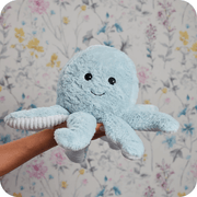 Warmies Octopus plush toy held in hand