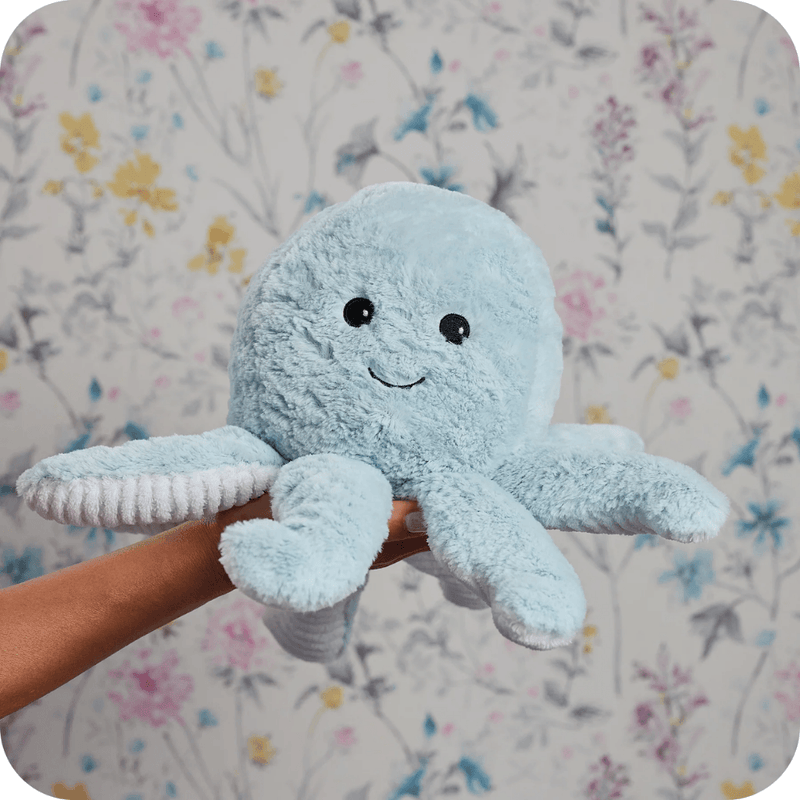 Warmies Octopus plush toy held in hand