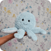 Warmies Octopus plush toy held in hand