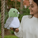 Warmies Pigeon plush toy being held outdoors