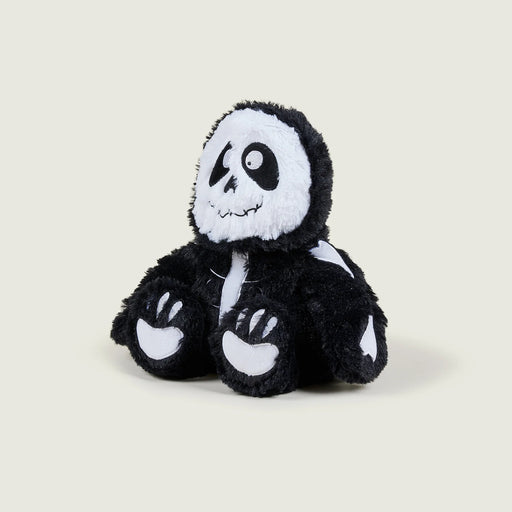 Angled view of Warmies Skeleton plush toy sitting upright
