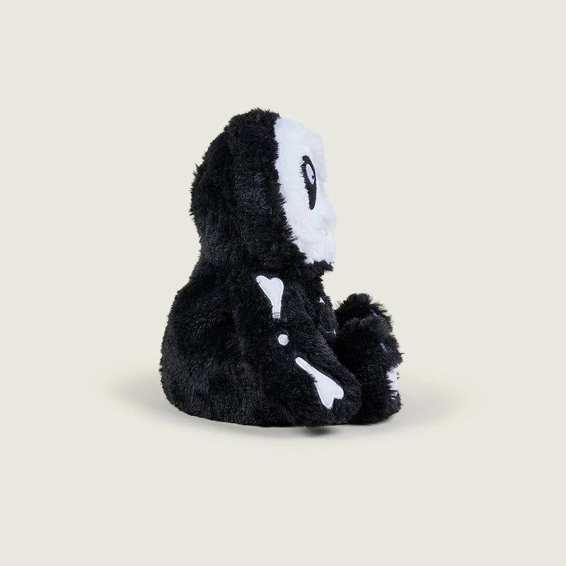 Right side view of Warmies Skeleton plush with bone design on arm