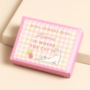 Gift box for mini trinket dish with Home Is Where The Cat Is design and illustration of a stretching white cat.
