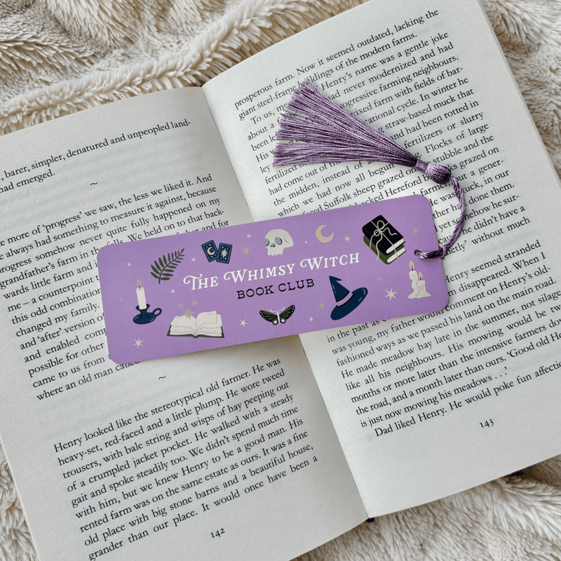 Whimsy Witch Book Club bookmark inside an open book