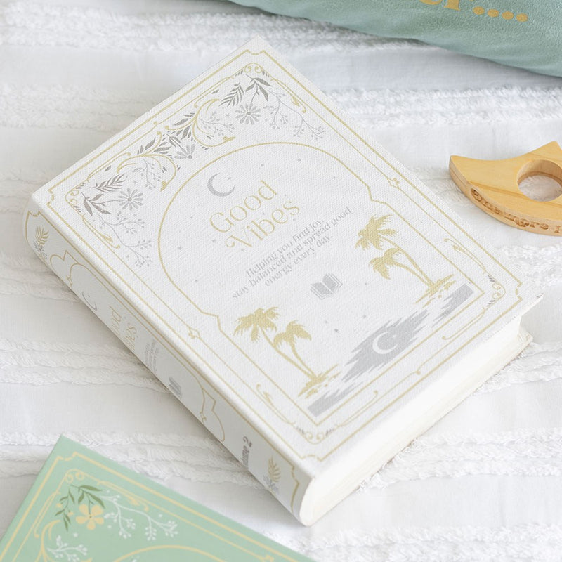 White book shaped storage box with Good Vibes cover design