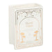 Upright white book shaped vase with Good Vibes cover design