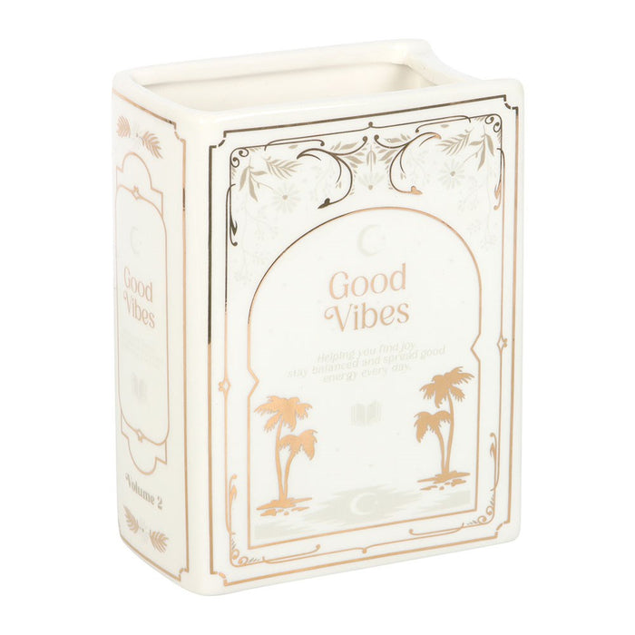 Front view of white Good Vibes ceramic book shaped vase