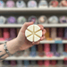 White Dove cream segmented wax melt held in hand