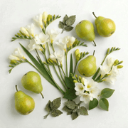 White freesia flowers and green pears representing the White Freesia & Pear diffuser fragrance