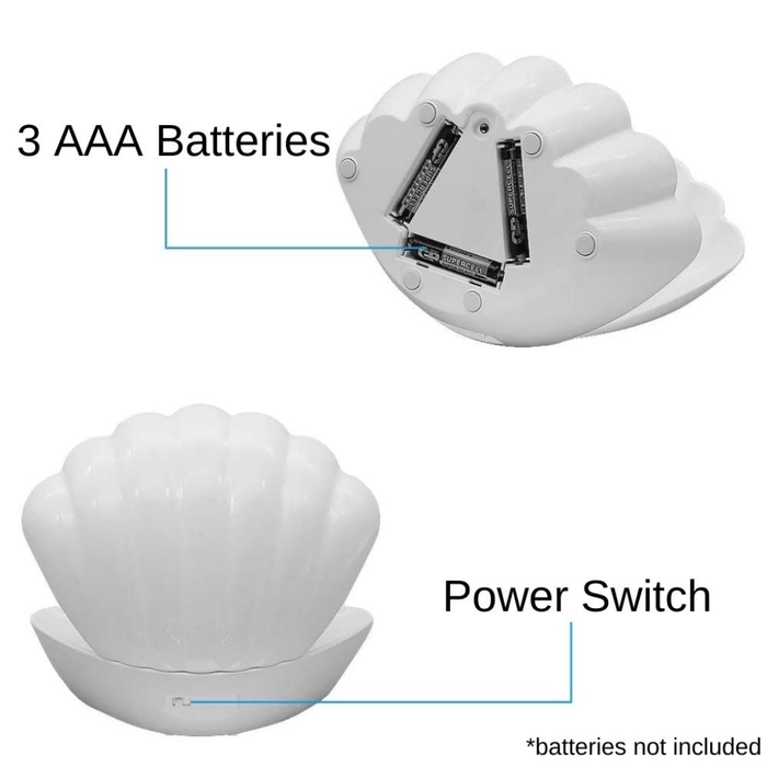 Back of white pearl LED clam lamp showing 3 AAA battery compartment and power switch.