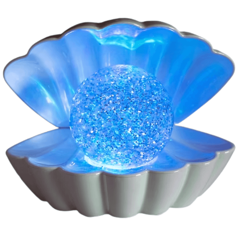 Close up of blue glowing glitter pearl inside white seashell LED clam night light.