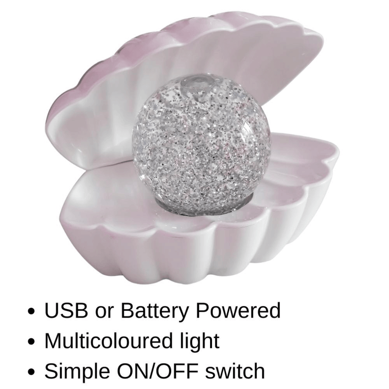 White pearlescent LED clam lamp with clear glitter pearl and text listing USB or battery powered features.