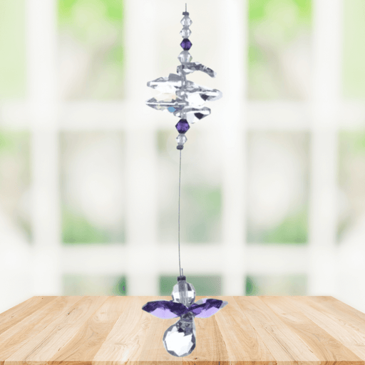 Amethyst guardian angel crystal cascade suncatcher hanging in a bright window
