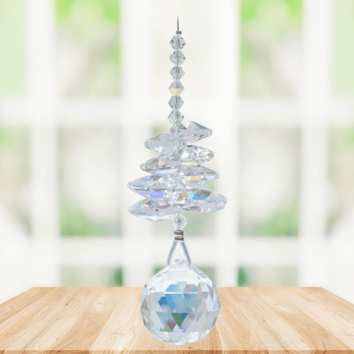 Wild Things Aurora Borealis birthstone crystal suncatcher hanging in a window with 20mm faceted ball pendant