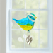 Blue Tit crystal suncatcher hanging in a sunny window, rainbow light ready to dance

