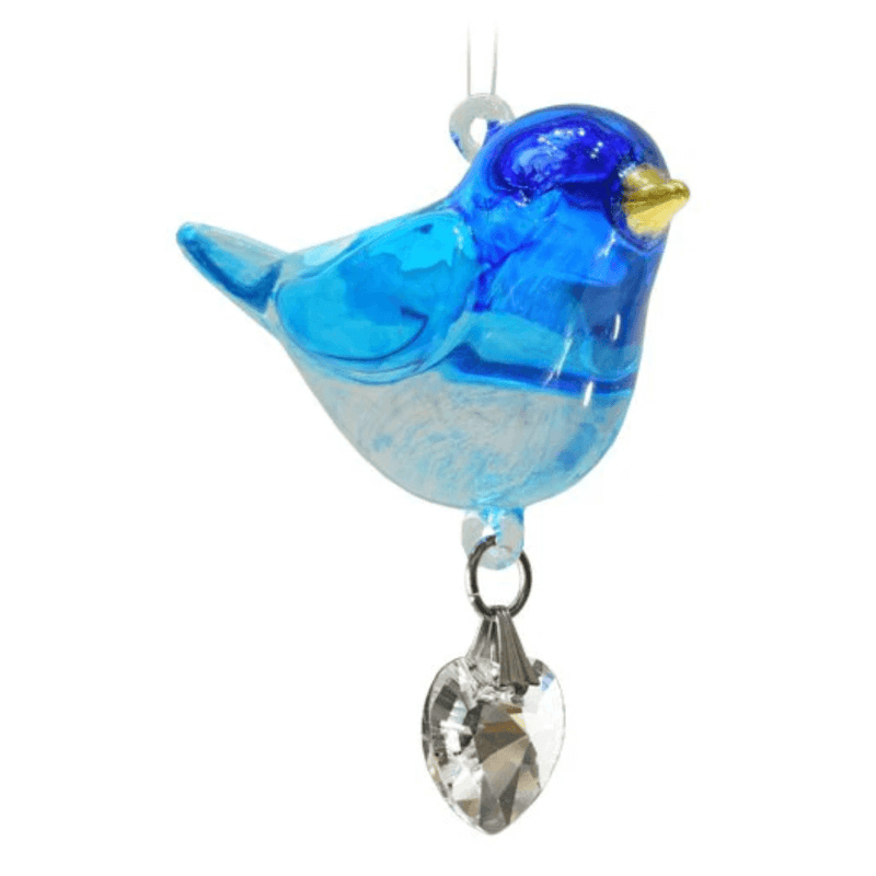 Close-up of handmade blue glass Bluebird suncatcher with heart-shaped crystal drop on white background


