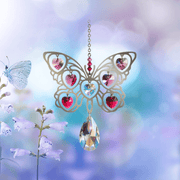 Butterfly crystal suncatcher glowing amid soft garden colours, ready to scatter pink-tinted rainbows

