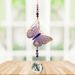 Butterfly Purple Emperor Crystal Suncatcher hanging in a sunny window; lavender-purple enamel wings, faceted violet beads and sparkling crystal ball.

